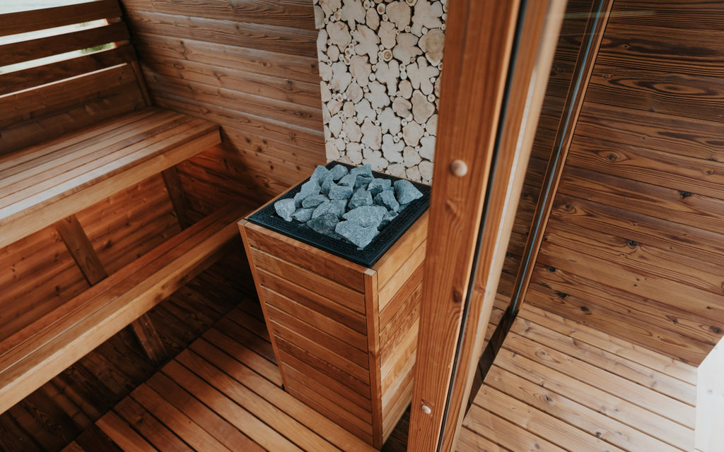 Auroom Nora barrel sauna interior with juniper bench