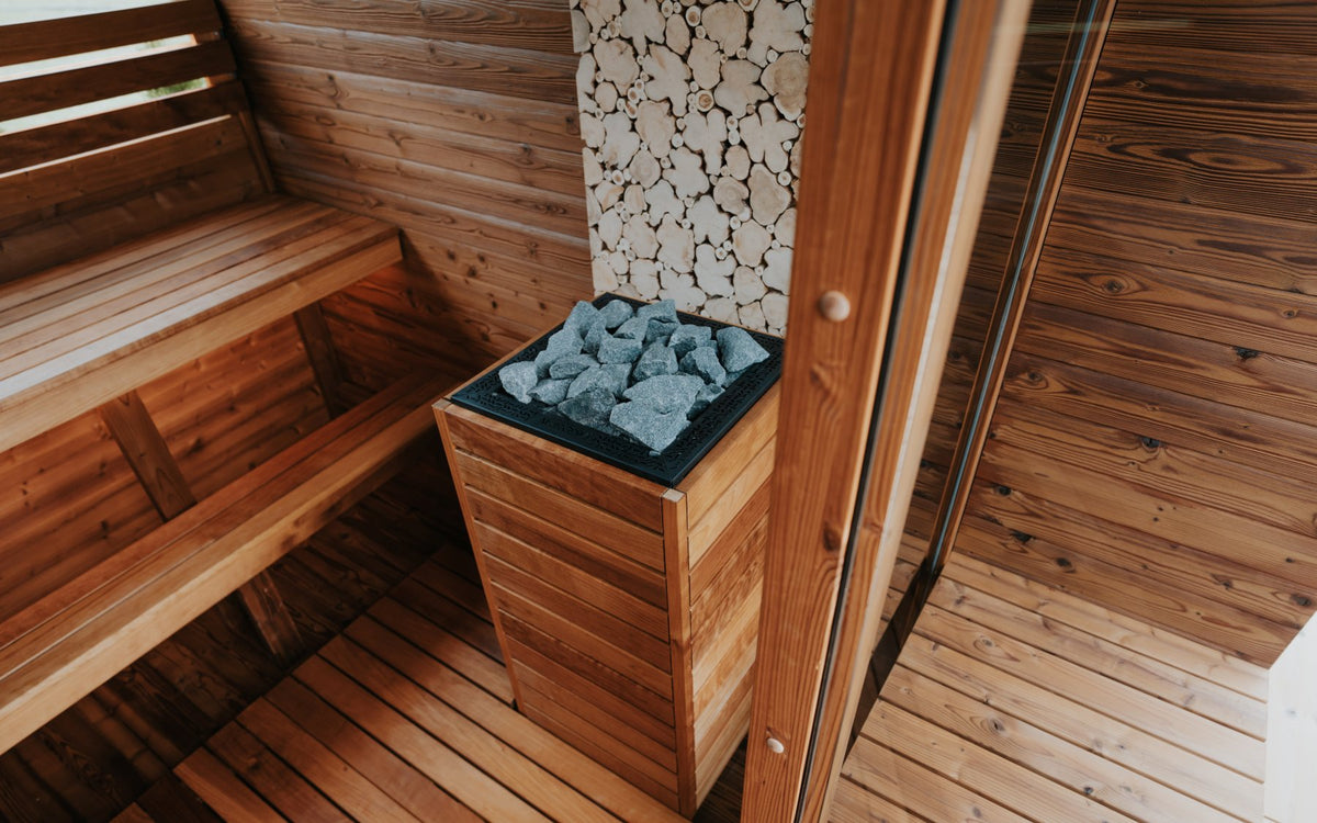 Auroom Nora barrel sauna interior with juniper bench
